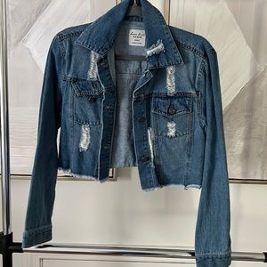Cropped distressed medium wash denim jacket